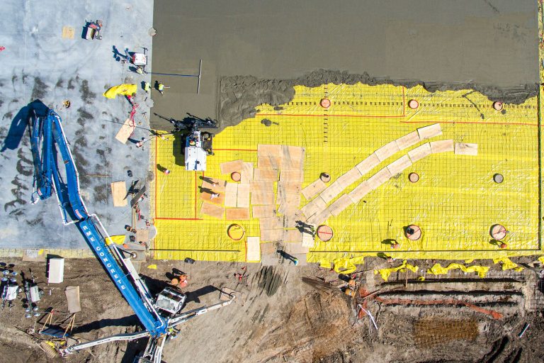 Drone construction progress aerial photograph of construction site.