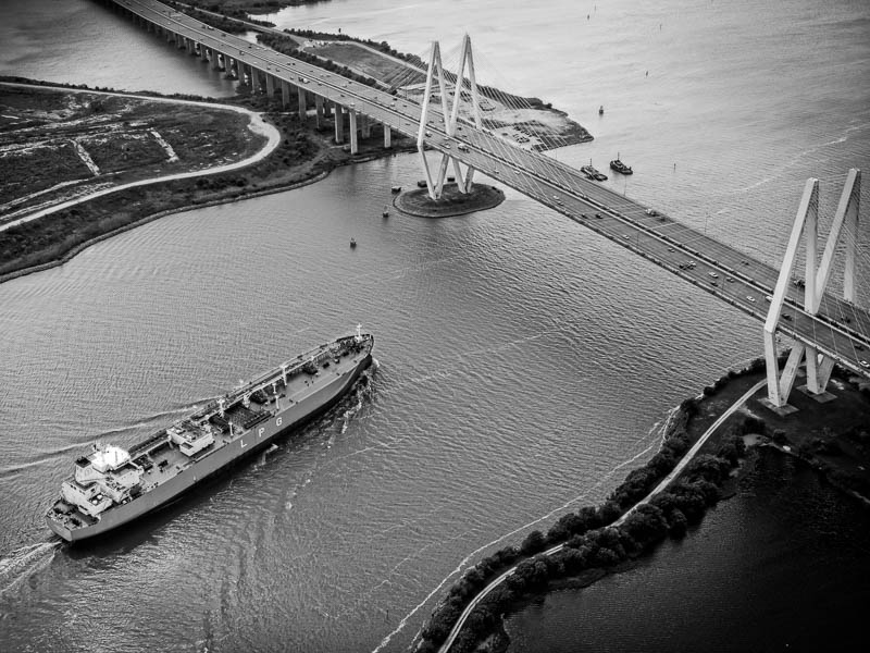 High quality aerial photo of tanker going under the Fred Hartman Bridge in Houston, Texas.