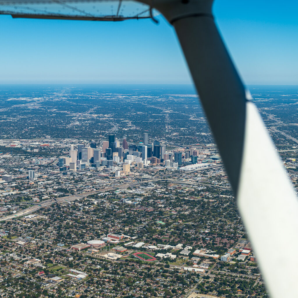 Aerial view of Houston, Texas through window of airplane.