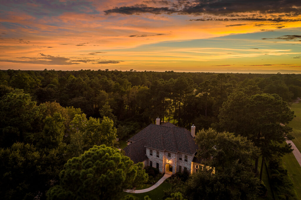 Drone aerial photography of home on golf course at sunset near Houston, Texas.